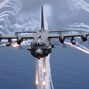 An AC-130H gunship aircraft jettisons flares as an infrared countermeasure