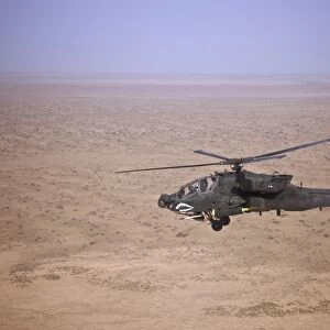 An AH-64D Apache Longbow fires a hydra rocket over Iraq