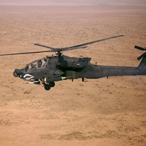 An AH-64D Apache Longbow fires a hydra rocket over northern Iraq