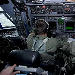 Airmen at work in a MC-130H Combat Talon II