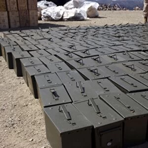 Ammunition boxes sit covered and aligned