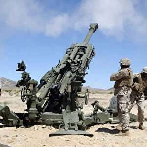 Artillerymen fire-off a round with the M777 Lightweight 155-millimeter Howitzer