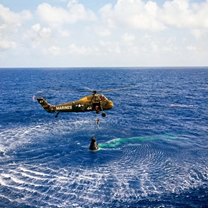 An astronaut is rescued by a U. S. Marine helicopter