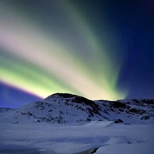 Aurora Borealis over Mikkelfjellet Mountain in Troms County, Norway