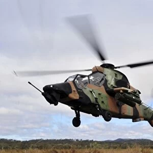 An Australian Army Tiger helicopter flies a reconnaissance mission