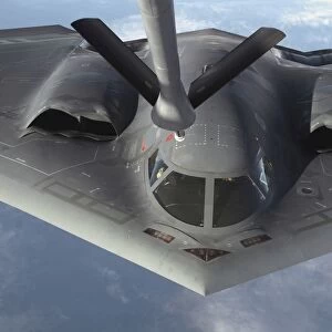 A B-2 Spirit bomber prepares to refuel from a KC-135 Stratotanker