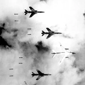 A B-66 Destroyer and F-105 Thunderchief aircraft bomb North Vietnam