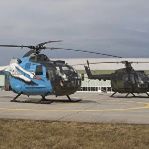 A Bo-105 liaison helicopter and a NH90 of the German Armed Forces