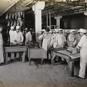 Branding smoked hams at the meat packing establishments, 1910