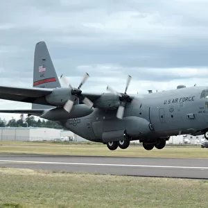 A C-130 Hercules lands at McChord Air Force Base, Washington