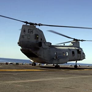 CH-46E Sea Knight helicopters practice vertical replenishments aboard USS Bataan
