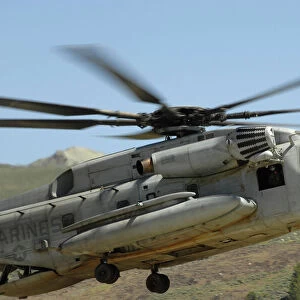 A CH-53 Super Stallion helicopter lands at the Mountain Warfare Training Center in