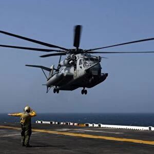 A CH-53E Super Stallion helicopter aboard the amphibious assault ship USS Bataan