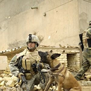 A dog handler and his military working dog take a short break