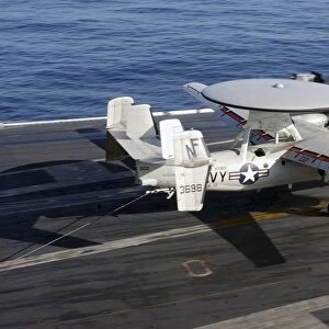 An E-2C Hawkeye makes a successful arrested landing aboard USS Kitty Hawk