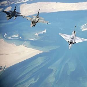 Emirati F-16s, an Emirati Mirage 2000, and a Pakistani F-7 fly in formation during