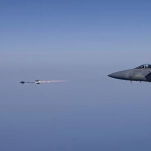 An F-15 Eagle fires an AIM-9 missile