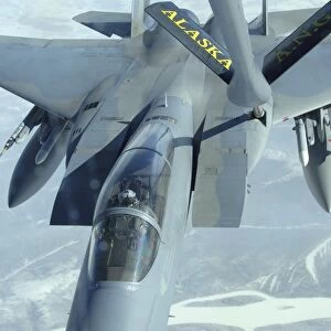 A F-15 Eagle receives fuel from a KC-135 Stratotanker