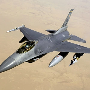 An F-16 Fighting Falcon in flight over Iraq
