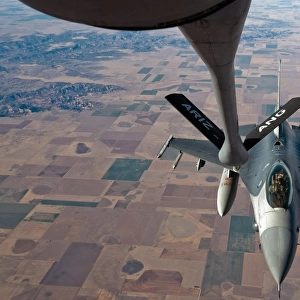 An F-16 Fighting Falcon moves into place to receive fuel from a KC-135 Stratotanker