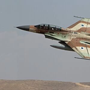 An F-16B Netz of the Israeli Air Force in flight over Israel