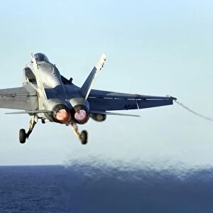 An F / A-18C Hornet launches from the flight deck of USS John C. Stennis