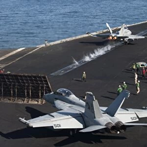 An F / A-18C Hornet launches from the the flight deck of USS Harry S. Truman