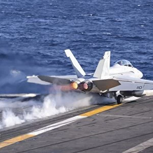 An F / A-18F Super Hornet launches from USS Nimitz