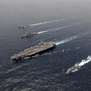 A formation of ships traveling at sea