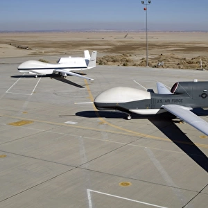 Two Global Hawks parked on a ramp