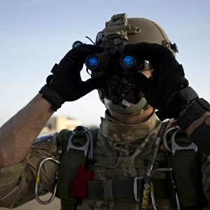 A Green Beret checks attached night vision device