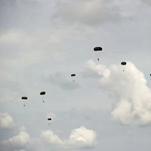 HALO jumpers descend to the ground after exiting a C-17 Globemaster III