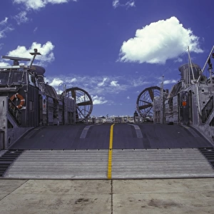 A landing craft air cushion is deflated on a ramp in Pearl Harbor, Hawaii