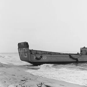 A landing craft beaches to unload troops during Operation Pony Express, 1961