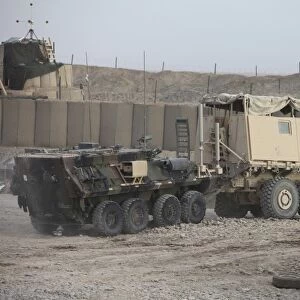 A light armored vehicle being towed at a military base in Afghanistan