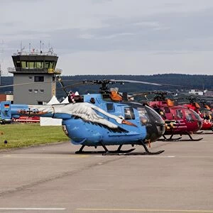 A line-up of 5 special colored Bo-105 helicopters of the German Army