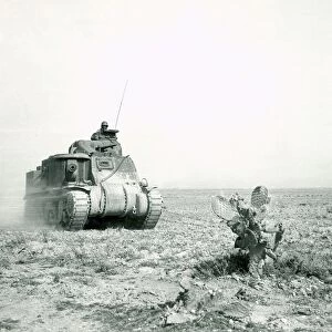 An M3 Grant tank on the move during the Battle of Kasserine Pass, Tunisia