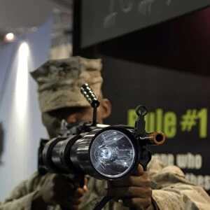 A marine tests the Night Hunter II, a rifle mountable flashlight