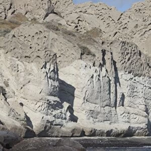 Massive weathered tuff deposits along the south coast of Santorini, Greece