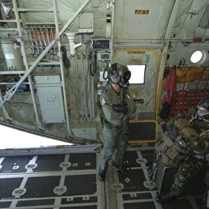Members of the Pathfinder Platoon await to jump from a Royal Air Force C-130 Hercules