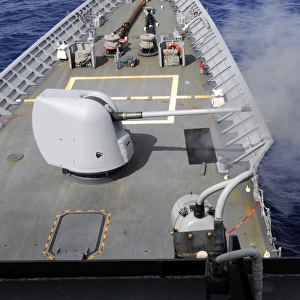 A Mk-45 5-inch. 54-caliber gun is fired aboard USS Cowpens