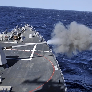 The MK-45 lightweight gun is fired aboard USS Halsey