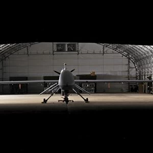 An MQ-1C Sky Warrior UAV parked in a hangar