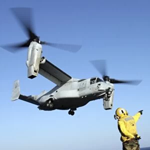 An MV-22 Osprey launches from the USS Nassau