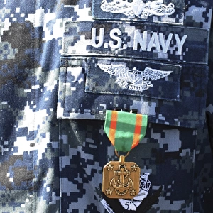 A Navy and Marine Corps Achievement Medal adorns the U. S. Navy uniform