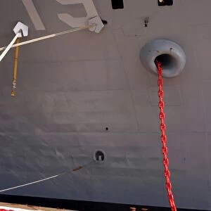 A new-12-shot anchor chain is hauled aboard the command ship USS Blue Ridge