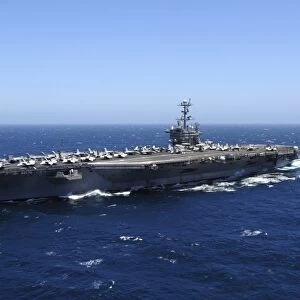 The Nimitz-class aircraft carrier USS John C. Stennis underway in the Pacific Ocean