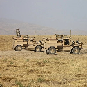 A pair of U. S. Army Cougar MRAP vehicles