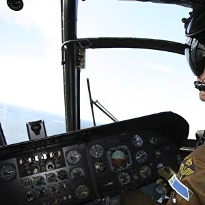 Pilot in the cockpit of a CH-46 Sea Knight helicopter of the Swedish Air Force