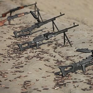 PK machine guns and spent cartridges at the firing range